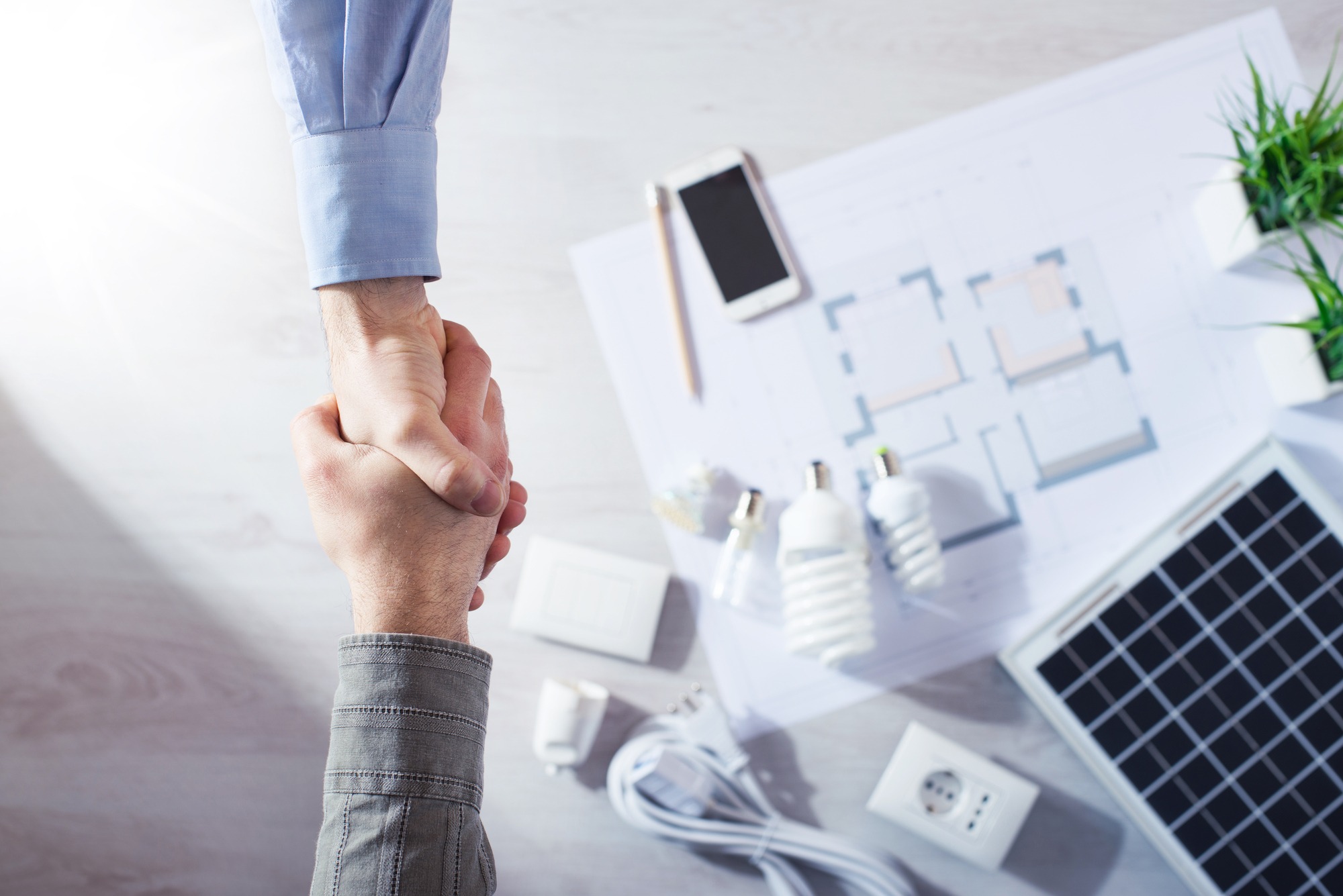 shaking hands made a sale for solar panel